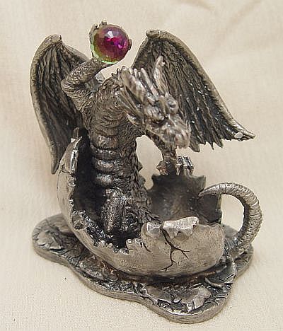 Tudor Mint's dragon hatchling cracks through his eggshell!