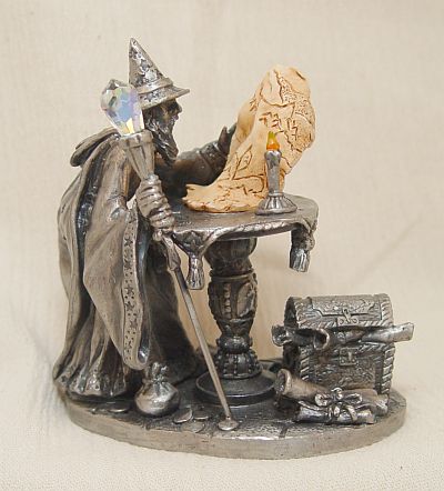 Tudor Mint's Wizard studies his parchment map while LOOKING for TREASURE
