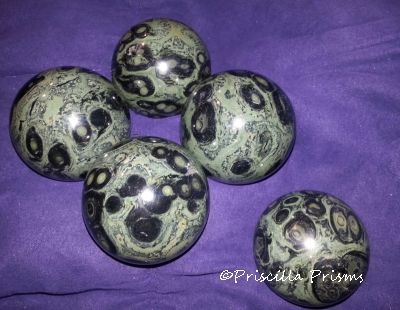 Colorful orbs of turquoise and black jasper set in crystalline matrix